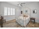 Bedroom with canopy bed and wood flooring at 11325 5Th E St, Treasure Island, FL 33706