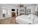 Main bedroom with king bed, wood floors and access to the balcony at 11325 5Th E St, Treasure Island, FL 33706