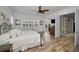 Main bedroom with king bed, wood floors and French doors to balcony at 11325 5Th E St, Treasure Island, FL 33706