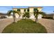Two-story waterfront home with two-car garage and tropical landscaping at 11325 5Th E St, Treasure Island, FL 33706