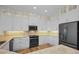 Modern kitchen with white cabinets and granite countertops at 11325 5Th E St, Treasure Island, FL 33706