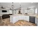 Large kitchen island and breakfast bar, granite counters and stainless steel appliances at 11325 5Th E St, Treasure Island, FL 33706