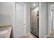 Walk-in shower with pebble stone floor and tile surround at 11325 5Th E St, Treasure Island, FL 33706