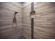 Walk-in shower with tile surround and pebble stone floor at 11325 5Th E St, Treasure Island, FL 33706