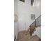 Elegant staircase with black metal railing at 11325 5Th E St, Treasure Island, FL 33706