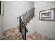 Elegant staircase with black metal railing at 11325 5Th E St, Treasure Island, FL 33706