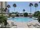 Large community pool with lounge chairs at 1180 Gulf Blvd # 1603, Clearwater Beach, FL 33767