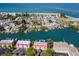 Aerial view of waterfront property, showcasing canal views and nearby beach at 12482 Capri N Cir # 4, Treasure Island, FL 33706