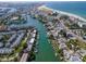 Aerial view of coastal town, highlighting waterfront properties and beach access at 12482 Capri N Cir # 4, Treasure Island, FL 33706