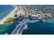 Aerial view of bridge, beach, and coastal town at 12482 Capri N Cir # 4, Treasure Island, FL 33706