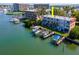 Aerial view of waterfront property with private boat slips at 12482 Capri N Cir # 4, Treasure Island, FL 33706