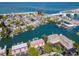 Aerial view of waterfront property with private boat docks and resort amenities at 12482 Capri N Cir # 4, Treasure Island, FL 33706