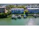 Aerial view of waterfront property with private boat slips at 12482 Capri N Cir # 4, Treasure Island, FL 33706