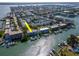 Aerial view highlighting waterfront location and private boat dock access at 12482 Capri N Cir # 4, Treasure Island, FL 33706