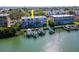 Aerial view of waterfront property with private boat slips at 12482 Capri N Cir # 4, Treasure Island, FL 33706