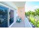 Private balcony with two green chairs and water views at 12482 Capri N Cir # 4, Treasure Island, FL 33706