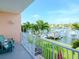Private balcony overlooking the canal, with seating and beautiful water views at 12482 Capri N Cir # 4, Treasure Island, FL 33706