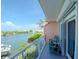 Relaxing balcony overlooking the water with outdoor seating at 12482 Capri N Cir # 4, Treasure Island, FL 33706