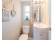 Clean bathroom with a white vanity and walk-in shower at 12482 Capri N Cir # 4, Treasure Island, FL 33706