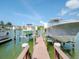 Two boat lifts and a shared dock on the waterway at 12482 Capri N Cir # 4, Treasure Island, FL 33706