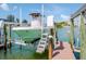 Private boat lift and dock with access to the waterway at 12482 Capri N Cir # 4, Treasure Island, FL 33706