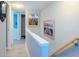 Bright hallway with beach themed art and access to bathroom at 12482 Capri N Cir # 4, Treasure Island, FL 33706