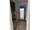 Hallway under renovation with exposed framing and flooring at 12482 Capri N Cir # 4, Treasure Island, FL 33706