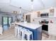 Modern kitchen featuring stainless steel appliances and a center island at 12482 Capri N Cir # 4, Treasure Island, FL 33706