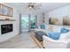 Spacious living area with a comfortable sectional sofa, fireplace, and water views at 12482 Capri N Cir # 4, Treasure Island, FL 33706
