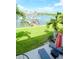 Waterfront patio with lounge chairs and stunning canal views at 12482 Capri N Cir # 4, Treasure Island, FL 33706