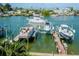 Boats docked at private piers with a view of the waterway at 12482 Capri N Cir # 4, Treasure Island, FL 33706