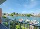 Balcony view of the waterway and docked boats at 12482 Capri N Cir # 4, Treasure Island, FL 33706