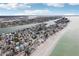 Aerial view of beachfront homes and coastline at 126 90Th Ave, Treasure Island, FL 33706