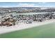 Aerial view of beachfront homes and coastline at 126 90Th Ave, Treasure Island, FL 33706