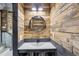 Rustic-style half bathroom with wood walls and a vessel sink at 126 90Th Ave, Treasure Island, FL 33706