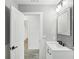 Bathroom with white vanity, gray walls, and access to another room at 126 90Th Ave, Treasure Island, FL 33706