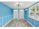 Bedroom with blue walls, wood floors, and double closets at 126 90Th Ave, Treasure Island, FL 33706