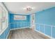 Bedroom with light blue walls and wood floors at 126 90Th Ave, Treasure Island, FL 33706
