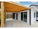 Covered carport with wooden beams and a sliding glass door at 126 90Th Ave, Treasure Island, FL 33706