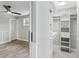 Bright walk-in closet with built-in shelving and drawers at 126 90Th Ave, Treasure Island, FL 33706