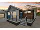 Modern deck with gray railings and blue door at 126 90Th Ave, Treasure Island, FL 33706