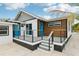 Modern deck with gray railings and blue door at 126 90Th Ave, Treasure Island, FL 33706