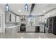 Newly renovated kitchen featuring gray cabinets, quartz countertops, and blue tile at 126 90Th Ave, Treasure Island, FL 33706