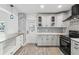 Contemporary kitchen with gray cabinets, white quartz countertops, and blue accents at 126 90Th Ave, Treasure Island, FL 33706