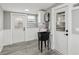 Laundry room with utility sink, white cabinetry, and gray flooring at 126 90Th Ave, Treasure Island, FL 33706