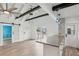Open concept living space with high ceilings, exposed beams, and kitchen island at 126 90Th Ave, Treasure Island, FL 33706