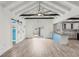 Spacious living area with high ceilings, wood floors, and sliding glass doors at 126 90Th Ave, Treasure Island, FL 33706