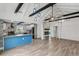 Spacious living room with vaulted ceiling, exposed beams, and hardwood floors at 126 90Th Ave, Treasure Island, FL 33706