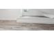 Versatile loft bedroom with built in sleeping platform and gray flooring at 126 90Th Ave, Treasure Island, FL 33706