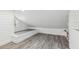 Bright loft bedroom featuring a built-in sleeping platform and gray flooring at 126 90Th Ave, Treasure Island, FL 33706